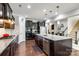 This kitchen offers granite countertops, stainless steel appliances, and dark cabinets with a built-in microwave at 129 Hawks Creek Pkwy, Fort Mill, SC 29708
