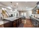 The kitchen includes a large island, granite countertops, stainless steel appliances, and an open floor plan at 129 Hawks Creek Pkwy, Fort Mill, SC 29708