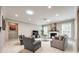 Bright living room with recessed lighting, fireplace, multiple windows, and neutral decor for a cozy ambiance at 129 Hawks Creek Pkwy, Fort Mill, SC 29708