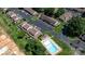 An aerial view of the property with manicured lawns, ample parking, a sparkling pool, and well-maintained buildings at 1330 5Th Ne St # 11, Hickory, NC 28601