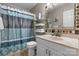 Well-lit bathroom featuring a patterned shower curtain and white vanity at 1330 5Th Ne St # 11, Hickory, NC 28601