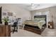 This bedroom includes a cozy bed, desk and overhead fan at 1330 5Th Ne St # 11, Hickory, NC 28601