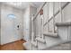 Welcoming entryway with a carpeted staircase and hardwood floors at 1330 5Th Ne St # 11, Hickory, NC 28601