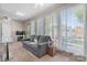 Cozy living room with a comfortable gray sofa and large windows letting in natural light at 1330 5Th Ne St # 11, Hickory, NC 28601