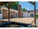 Backyard with a large deck area, beautiful pond, and brick exterior of the home at 1613 Spangler Dr, Shelby, NC 28150