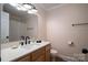 Bathroom featuring a light wood vanity, white countertop and hardware, and large mirror at 1613 Spangler Dr, Shelby, NC 28150