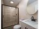 Nicely remodeled bathroom offers a large glass shower, modern vanity, and beautiful fixtures at 1613 Spangler Dr, Shelby, NC 28150