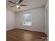 Bedroom features hardwood-style floors, neutral walls, and windows for natural light at 1613 Spangler Dr, Shelby, NC 28150