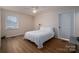Bedroom with large window, ceiling fan, and closet provides comfort and style at 1613 Spangler Dr, Shelby, NC 28150