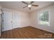 Neutral bedroom featuring wood-look floors, closet, and abundant natural light at 1613 Spangler Dr, Shelby, NC 28150