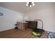Bonus room featuring hardwood-style floors, neutral walls, and wet bar at 1613 Spangler Dr, Shelby, NC 28150