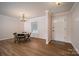 Bright dining room with modern lighting, hardwood floors, and natural light at 1613 Spangler Dr, Shelby, NC 28150