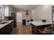 This kitchen offers sleek stainless appliances, tile backsplash, and a breakfast bar with seating at 1613 Spangler Dr, Shelby, NC 28150