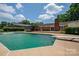 Enjoy the backyard pool with diving board and surrounding patio, ideal for summer fun and relaxation at 1613 Spangler Dr, Shelby, NC 28150
