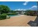 Inviting backyard pool with spacious deck and charming pergola, perfect for outdoor entertaining at 1613 Spangler Dr, Shelby, NC 28150