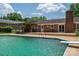 Backyard pool with a diving board, connecting to a wooden deck with a charming outdoor seating area at 1613 Spangler Dr, Shelby, NC 28150