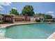 Enjoy a spacious pool with lush greenery and a charming pergola creating the perfect spot for outdoor gatherings at 1613 Spangler Dr, Shelby, NC 28150