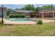 Backyard pool with diving board and a quaint pergola perfect for relaxation and outdoor entertaining at 1613 Spangler Dr, Shelby, NC 28150