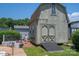 Charming exterior view of shed and pool; the exterior features a unique barn door design at 1613 Spangler Dr, Shelby, NC 28150