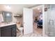 Bathroom with a large door to an attached bedroom and tiled floor and marble countertop at 2024 5Th Street Nw Pl, Hickory, NC 28601
