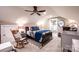 Inviting bedroom showcases a large bed, vaulted ceilings, neutral colors, and a ceiling fan at 2024 5Th Street Nw Pl, Hickory, NC 28601