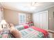 Bright bedroom featuring two twin beds, plush pillows, and ample closet space at 2024 5Th Street Nw Pl, Hickory, NC 28601