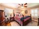 Elegant bedroom with four-poster bed, hardwood floors, and stylish decor at 2024 5Th Street Nw Pl, Hickory, NC 28601
