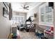 Cozy bonus room featuring gray painted brick walls, a ceiling fan, and a carpeted floor at 2024 5Th Street Nw Pl, Hickory, NC 28601