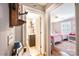 Hallway view leading to a charming bathroom and bedroom with hardwood floors at 2024 5Th Street Nw Pl, Hickory, NC 28601