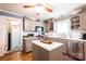 Charming kitchen features gray cabinets, stainless steel appliances, and a cozy island at 2024 5Th Street Nw Pl, Hickory, NC 28601