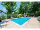 Beautiful in-ground pool with an adjacent pergola, perfect for outdoor entertaining and relaxation at 2024 5Th Street Nw Pl, Hickory, NC 28601