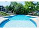 Refreshing in-ground swimming pool with a diving platform and surrounding deck, ideal for summer fun at 2024 5Th Street Nw Pl, Hickory, NC 28601