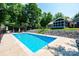 Swimming pool area with pergola and steps leading up to house at 2024 5Th Street Nw Pl, Hickory, NC 28601
