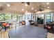 Inviting sunroom with wood ceiling, hot tub, and comfortable seating, perfect for relaxation and entertaining at 2024 5Th Street Nw Pl, Hickory, NC 28601