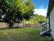 Backyard with a playset, tree, and fence at 208 S Ransom St, Gastonia, NC 28052