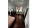 Bedroom featuring hardwood floors, modern paneled walls, and natural light from the window at 208 S Ransom St, Gastonia, NC 28052