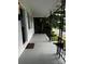 Large front porch with gray floors and black railings at 208 S Ransom St, Gastonia, NC 28052