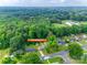 Wide aerial view showing the property location amidst a lush, green landscape at 2111 Parkdale Ave, Gastonia, NC 28052