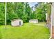 A spacious backyard features two storage sheds, perfect for outdoor equipment at 2111 Parkdale Ave, Gastonia, NC 28052