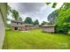 Expansive backyard showing a shed, patio, and the rear exterior of the home at 2111 Parkdale Ave, Gastonia, NC 28052