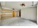 Spacious basement room with carpet, partial brick wall, and doorway at 2111 Parkdale Ave, Gastonia, NC 28052