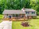 Aerial view of a beautiful two-story home with a large yard and deck at 2111 Parkdale Ave, Gastonia, NC 28052