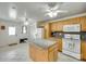 Open kitchen with a granite island, stainless steel appliances, and plenty of cabinet space for efficient cooking at 2111 Parkdale Ave, Gastonia, NC 28052