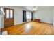 Inviting living room with hardwood floors, a front door, and a bright window at 2111 Parkdale Ave, Gastonia, NC 28052