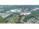 Aerial view featuring industrial buildings, commercial areas, and winding roads, set amidst lush greenery at 270 Kilmer Ln, Mooresville, NC 28115