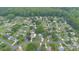 Aerial view of a suburban neighborhood, featuring well-maintained homes, lush trees, and winding roads, a serene setting at 270 Kilmer Ln, Mooresville, NC 28115