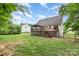 Expansive backyard with a wooden deck, a gazebo, and a partially fenced yard, ideal for outdoor entertaining at 270 Kilmer Ln, Mooresville, NC 28115