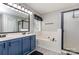 Full bathroom featuring a double vanity, a shower with glass door, and a soaking tub at 270 Kilmer Ln, Mooresville, NC 28115