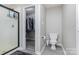 Full bathroom featuring a shower with glass door, closet, and toilet at 270 Kilmer Ln, Mooresville, NC 28115