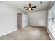 Bedroom with carpet, white walls, two windows, and closets at 270 Kilmer Ln, Mooresville, NC 28115